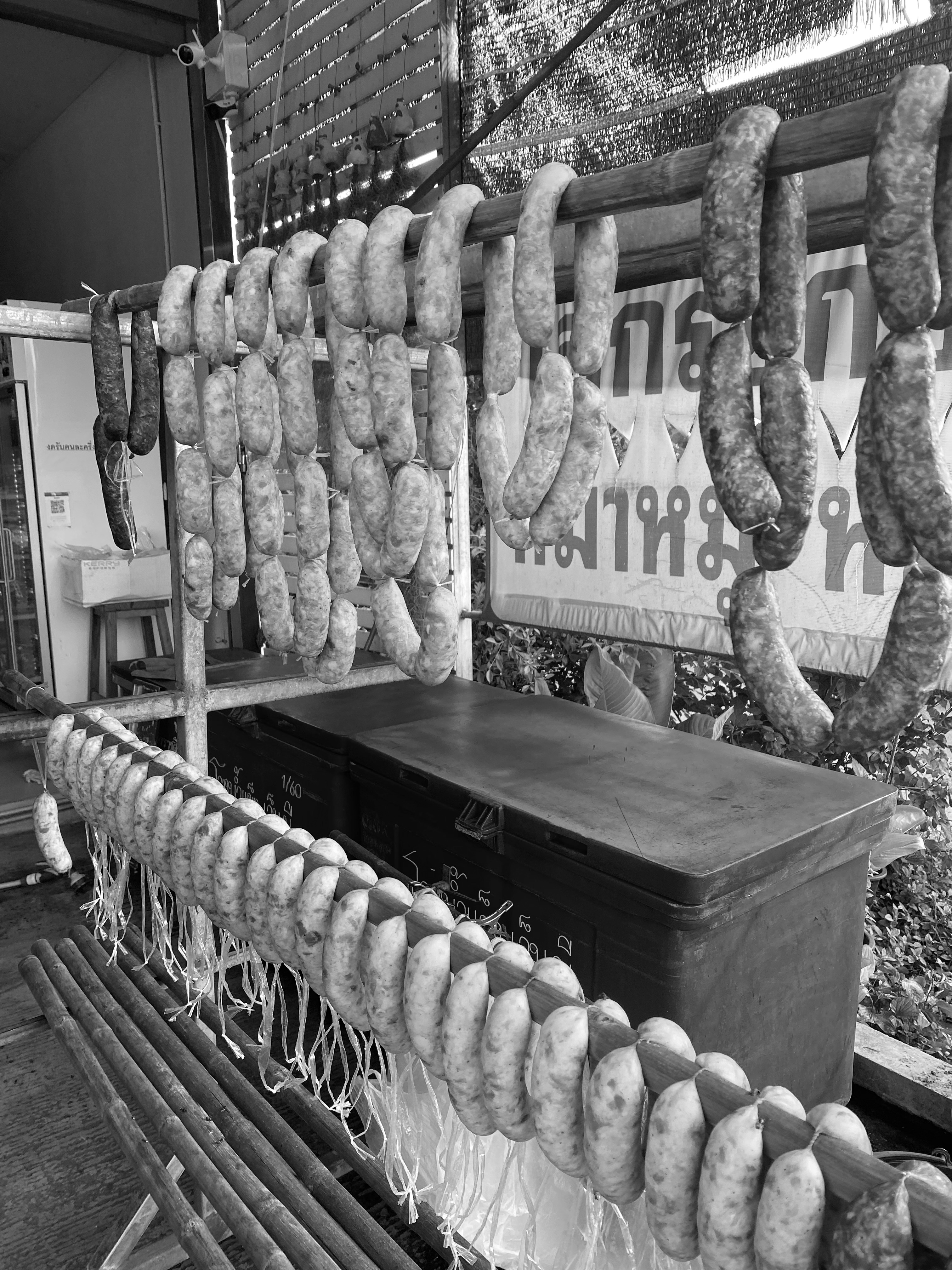 Sampling sausage meat from the popular roadside food carts
